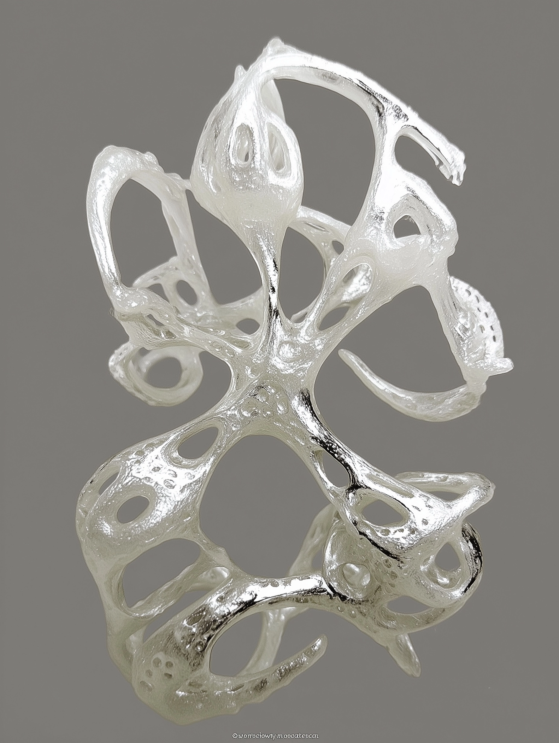 Abstract organic sculptural object, pale translucent yellow material with smooth soft surface