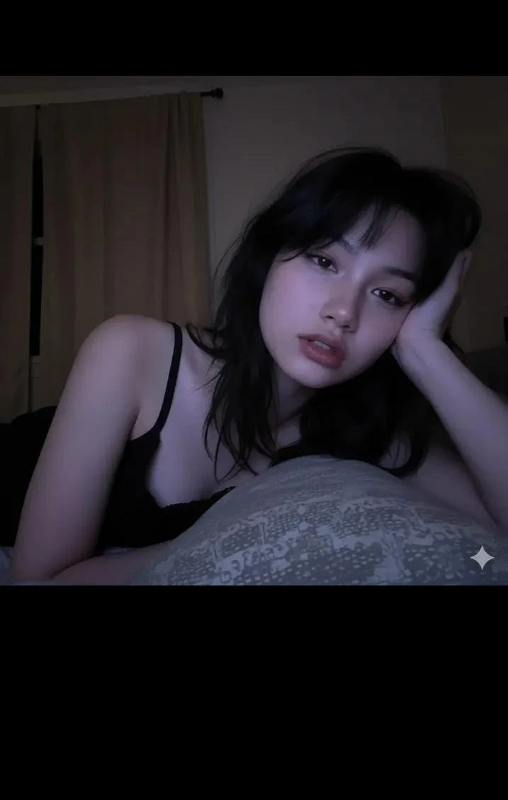 Vertical low-light night selfie with cool glow