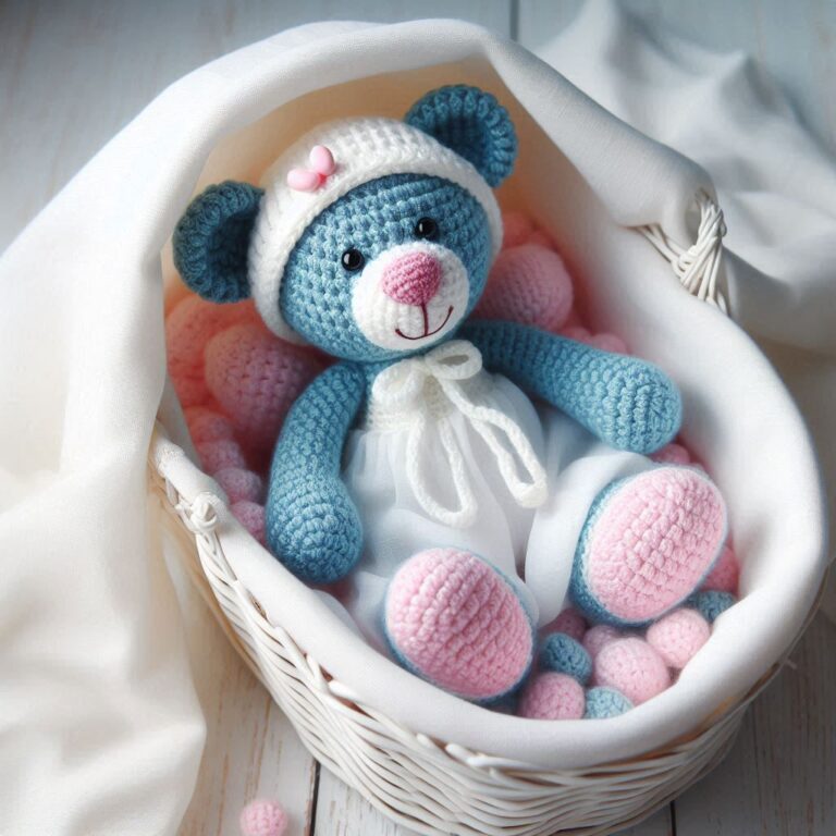 A crochet blue/pink teddy bear