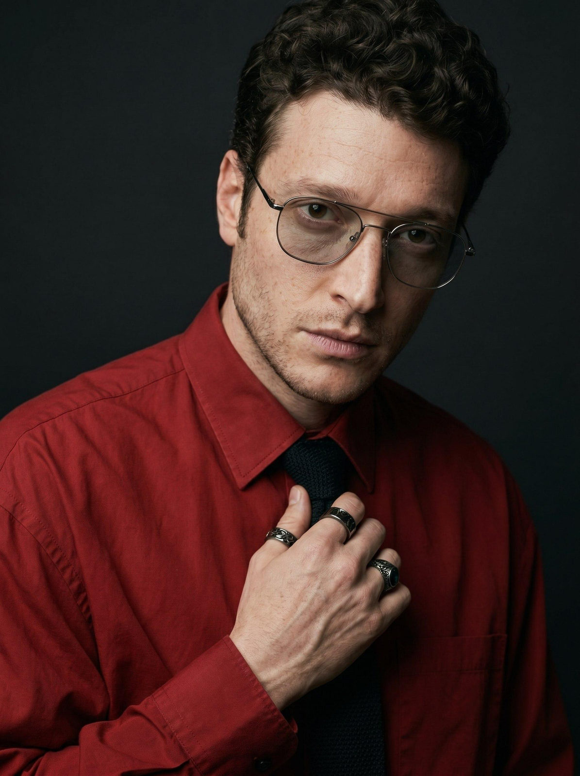 Red Shirt Man Tugging Tie