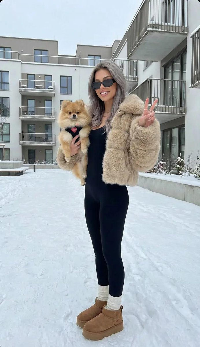 Winter Fashion Portrait With Pomeranian Dog