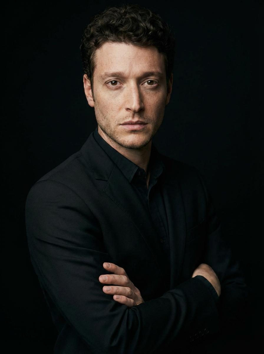 Confident Man in Black Suit