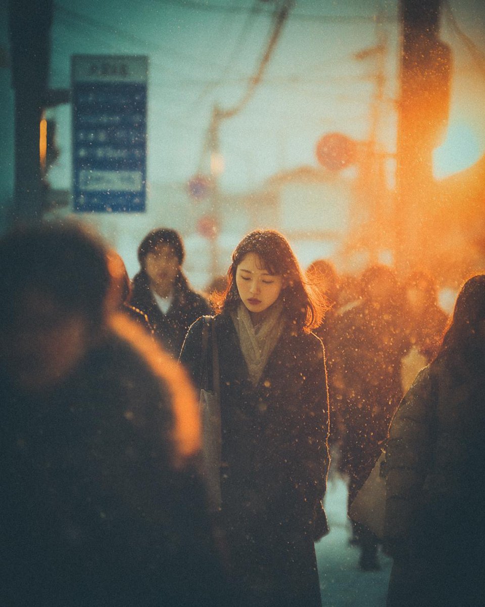 Solitary Girl Walking In Snowy City