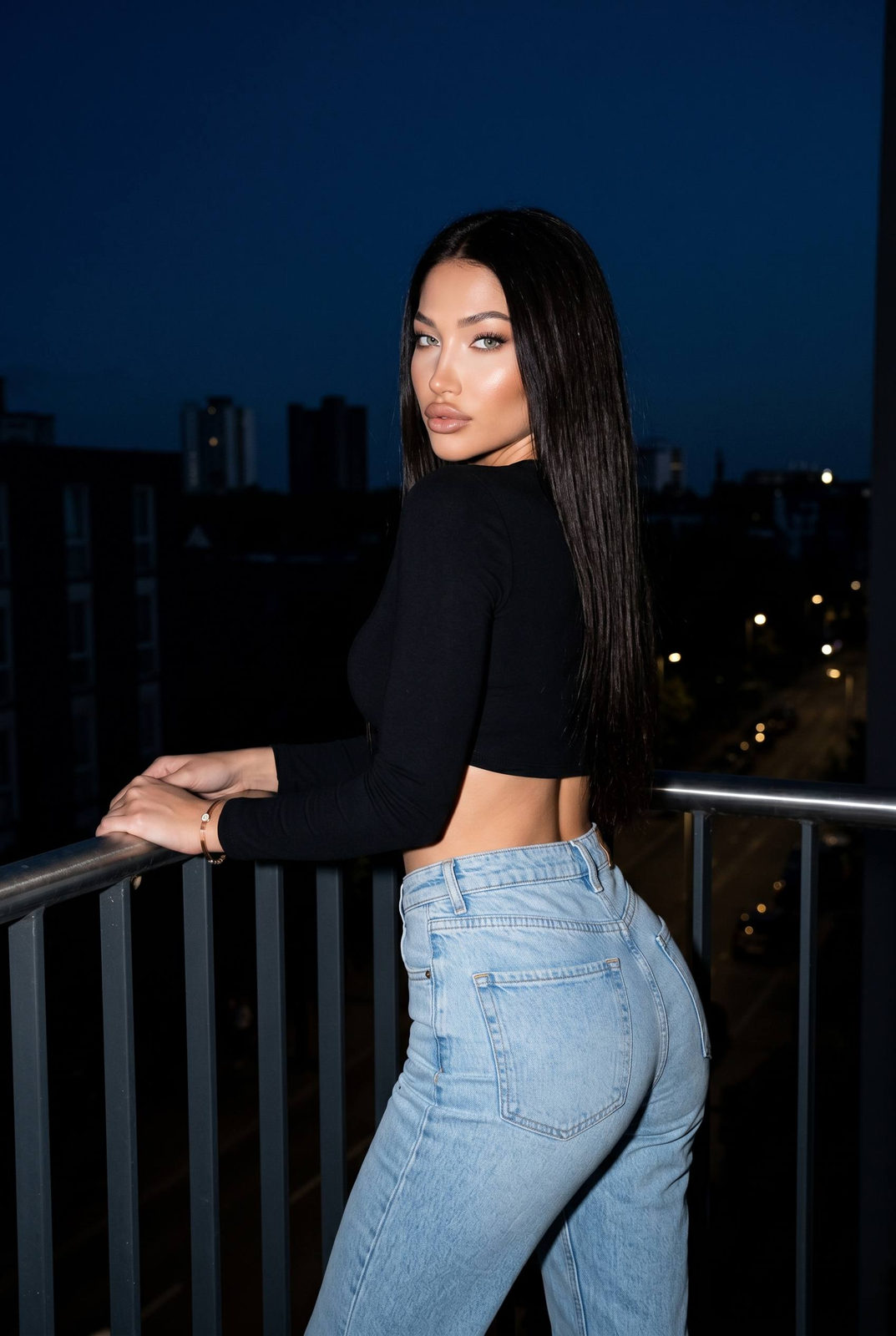 Night Balcony Over-Shoulder Portrait