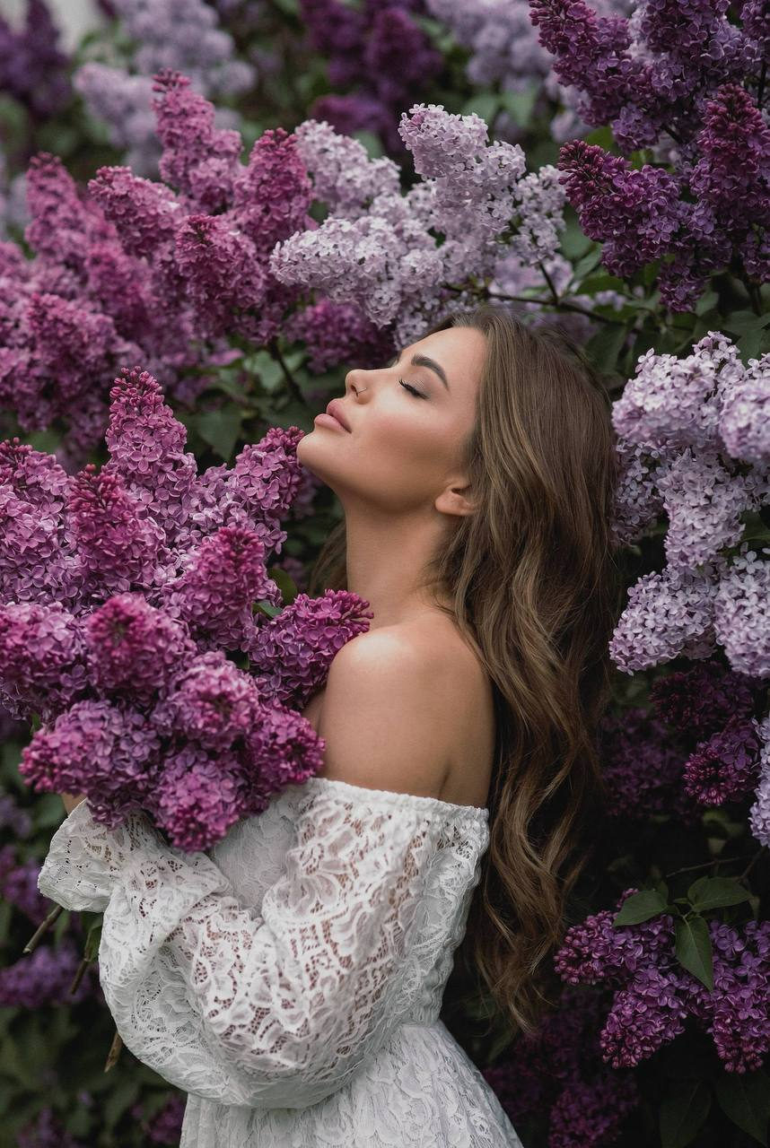 Contemplative Portrait Amidst Lilac Blooms