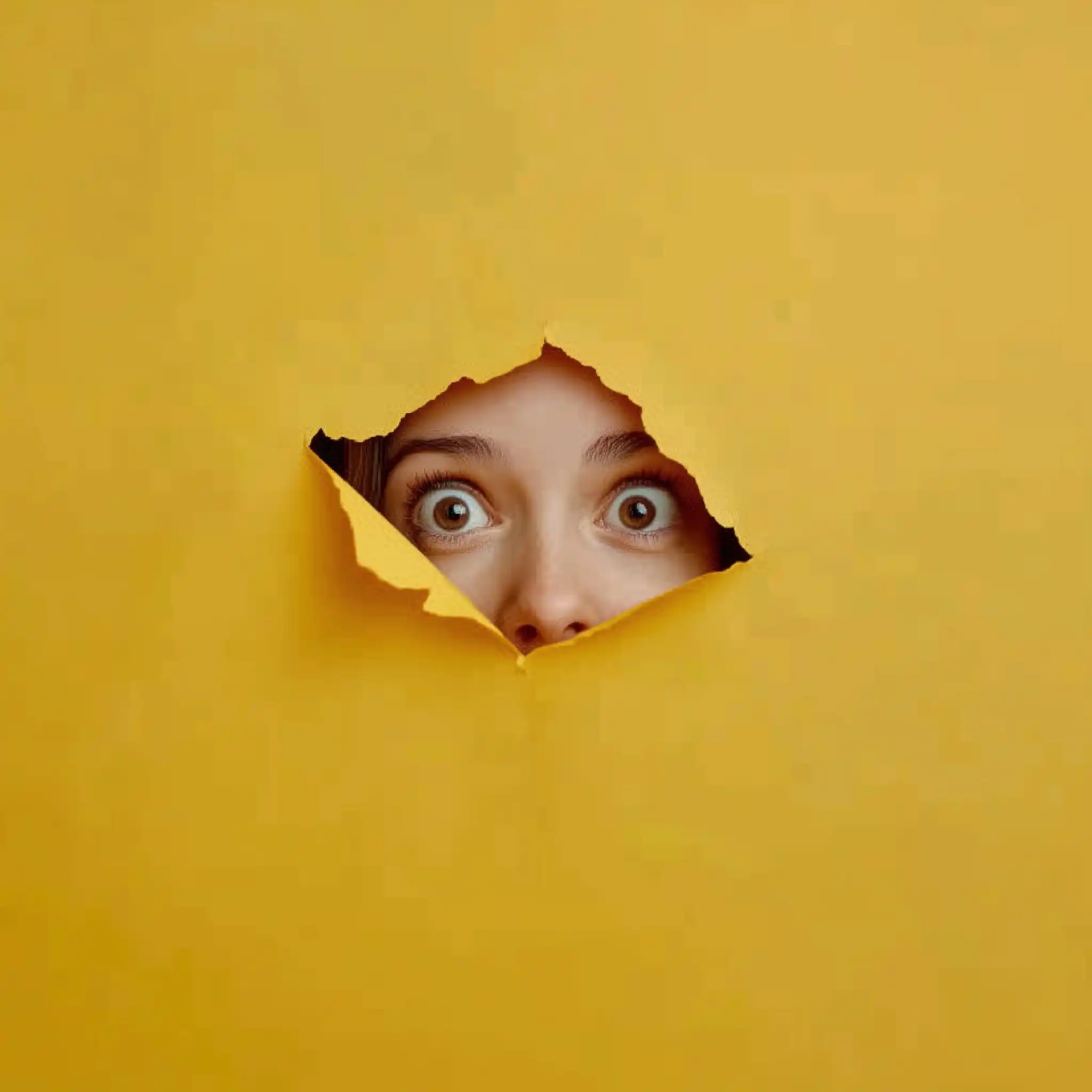 Cheerful Woman Through Yellow Paper