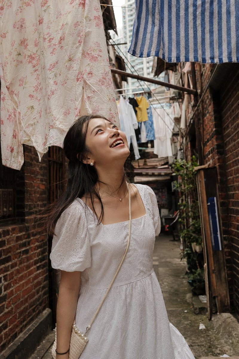 Alley Girl Beneath Laundry Lines
