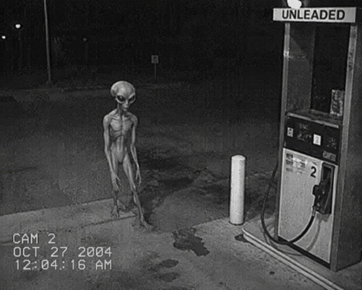Grainy CCTV Alien at Gas Station