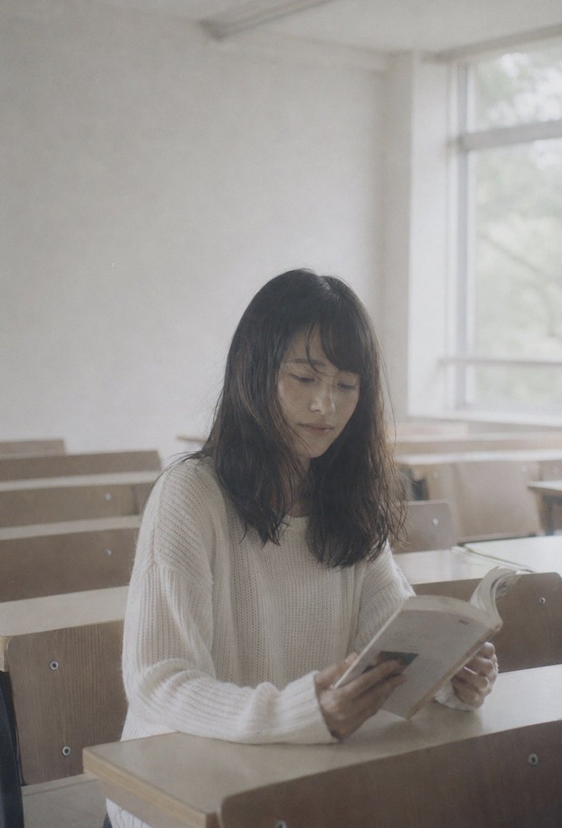 Anonymous Reader by Sunlit Window