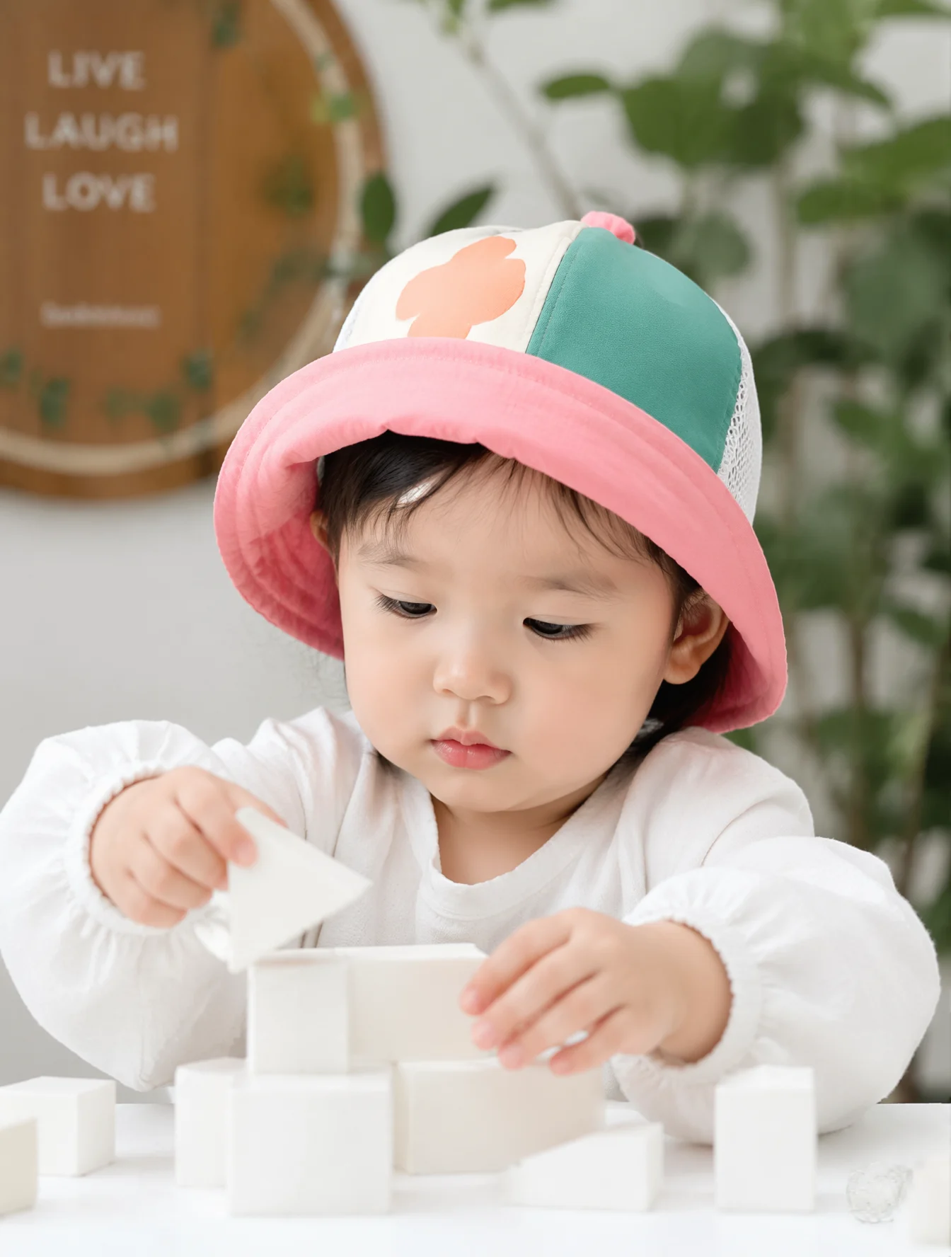 Toddler Playing With White Blocks