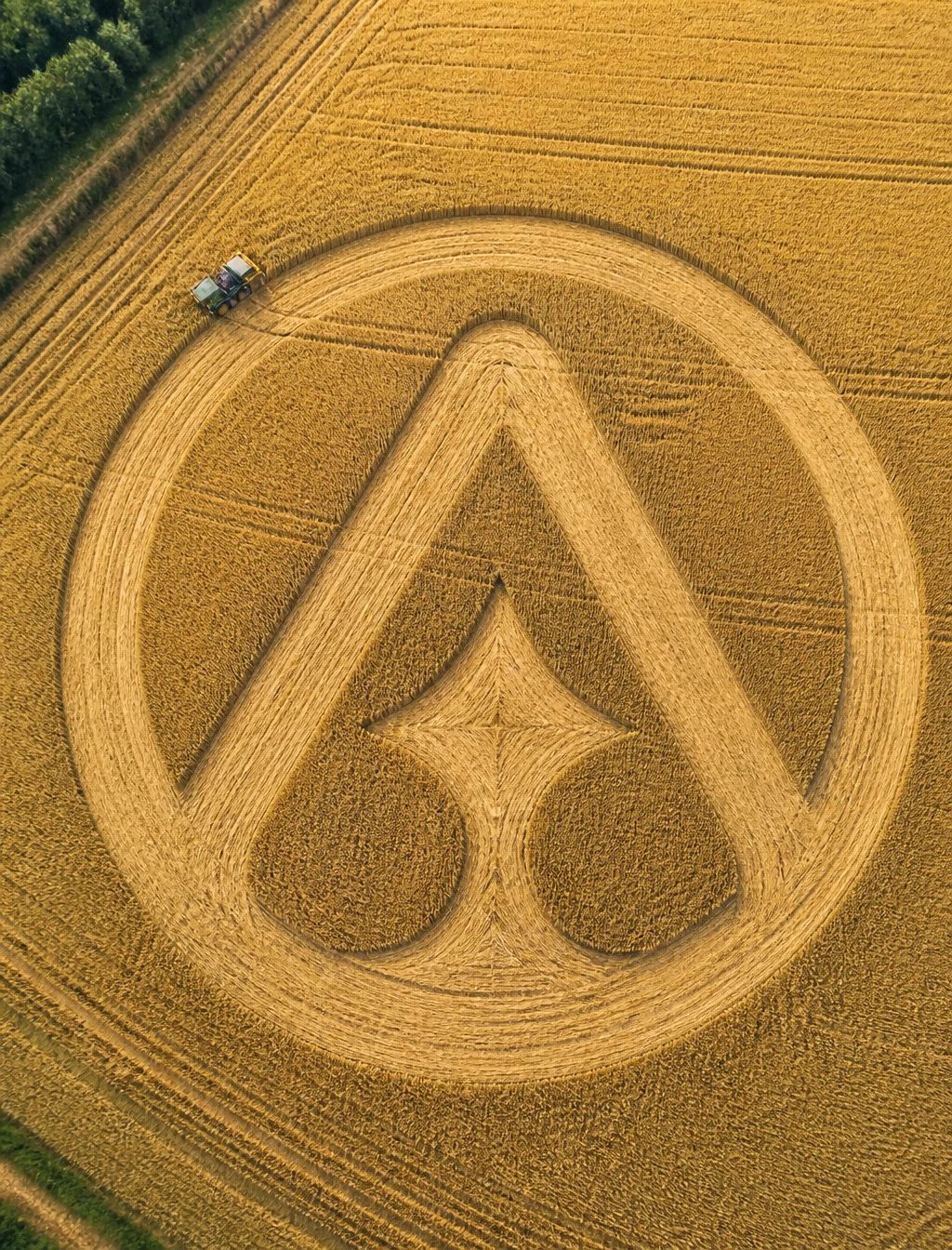 Tractor Draws Logo in Wheat Field