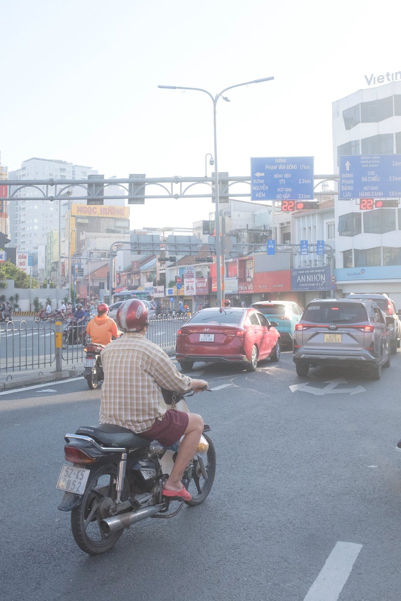 Vietnamese Riding Motorbikes in Rain