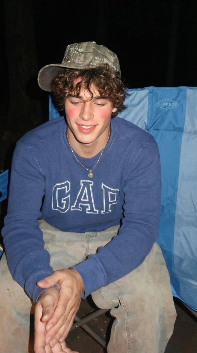 Smiling Teen Boy In Woods
