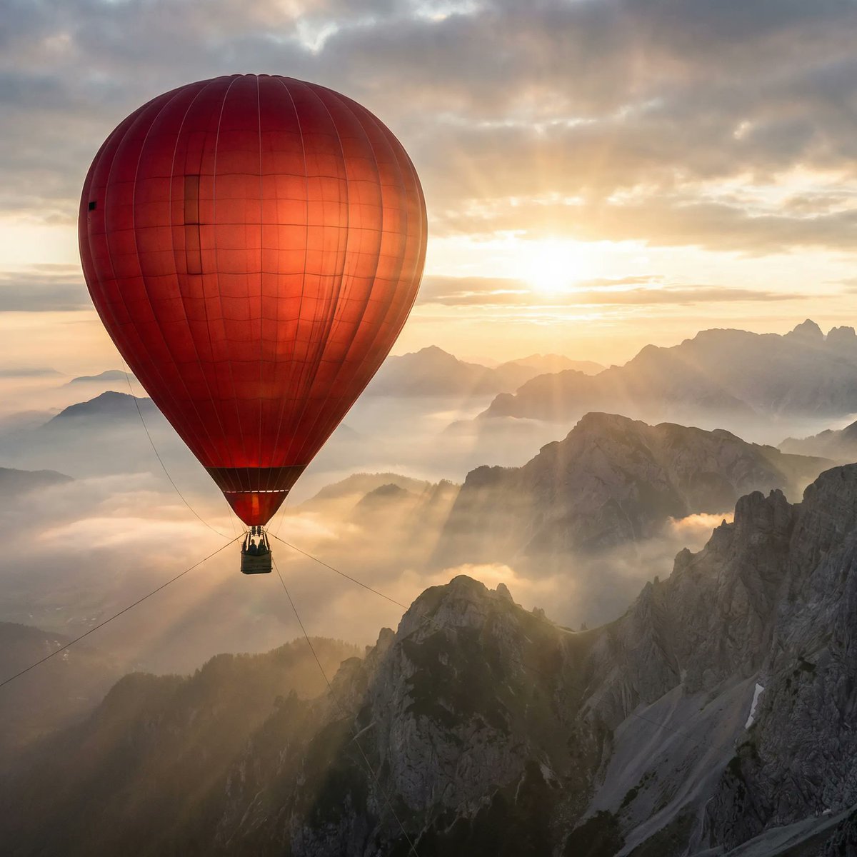 Red Balloons Floating Above Misty Mountains
