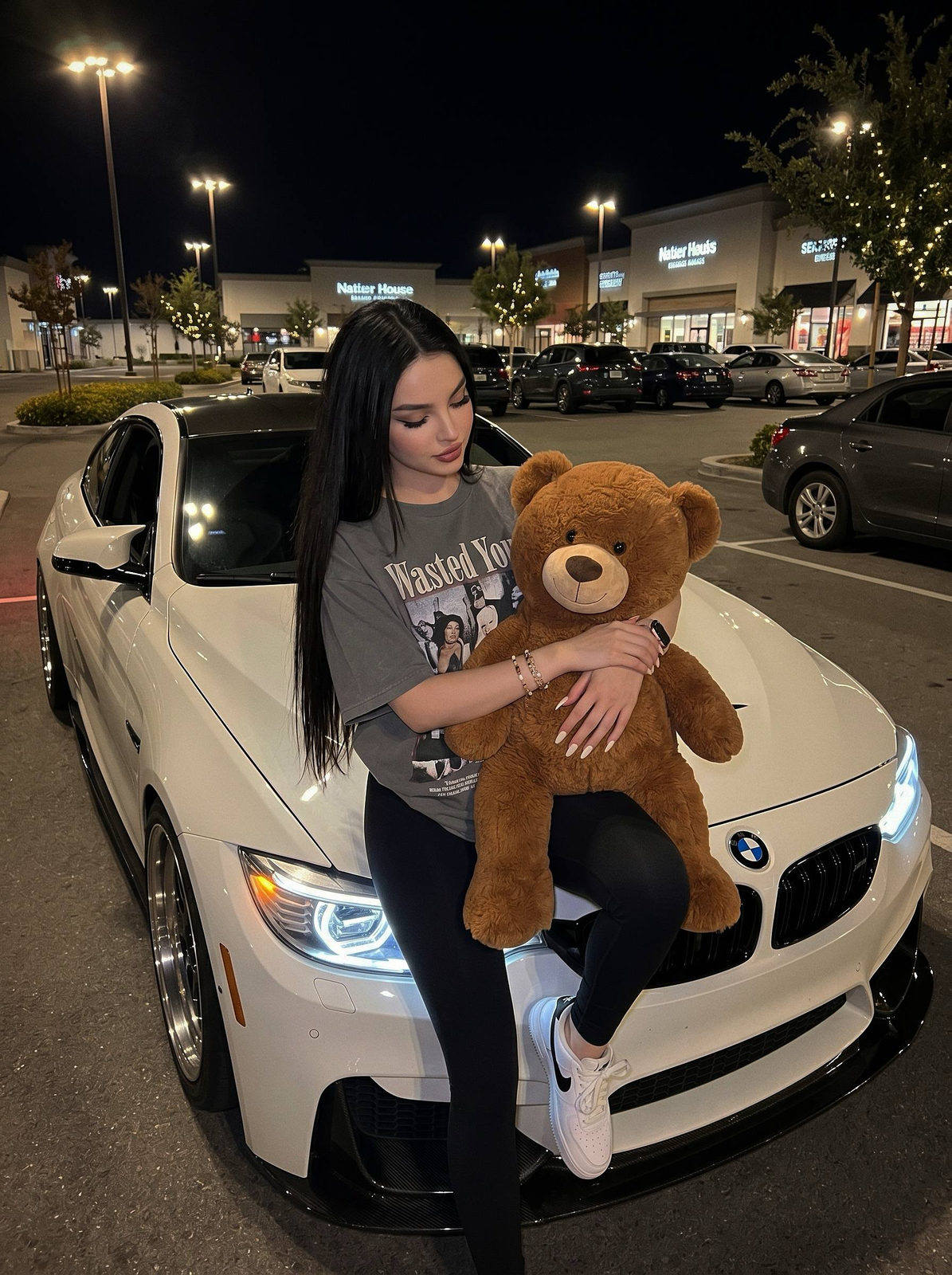 Girl Hugging Teddy Bear on Car Hood