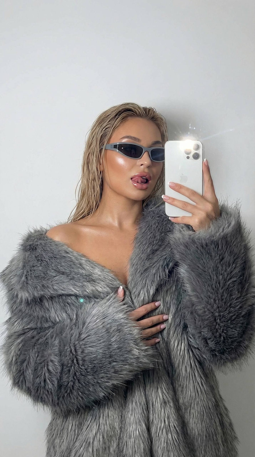 Playful Mirror Selfie in Fur Coat
