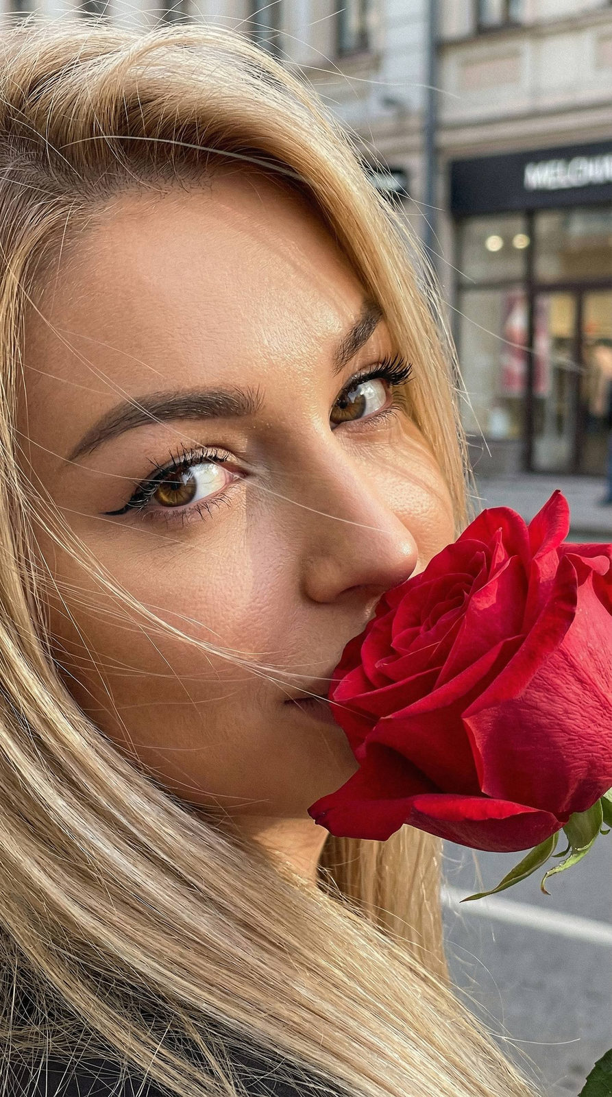 Girl With Red Rose Closeup