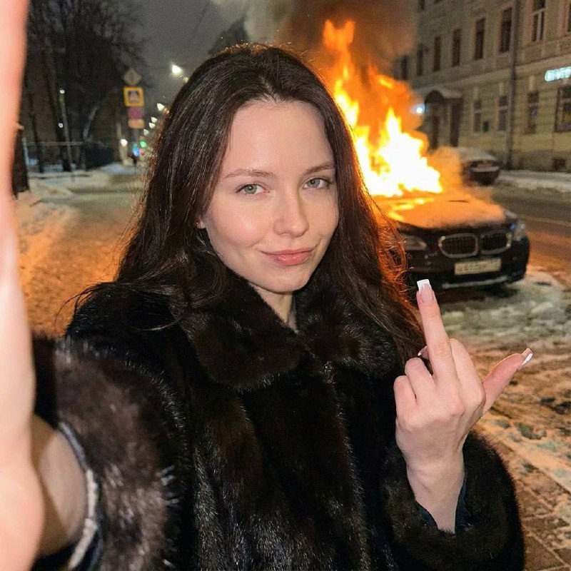 Smug Fur Girl Flips Off Burning Car