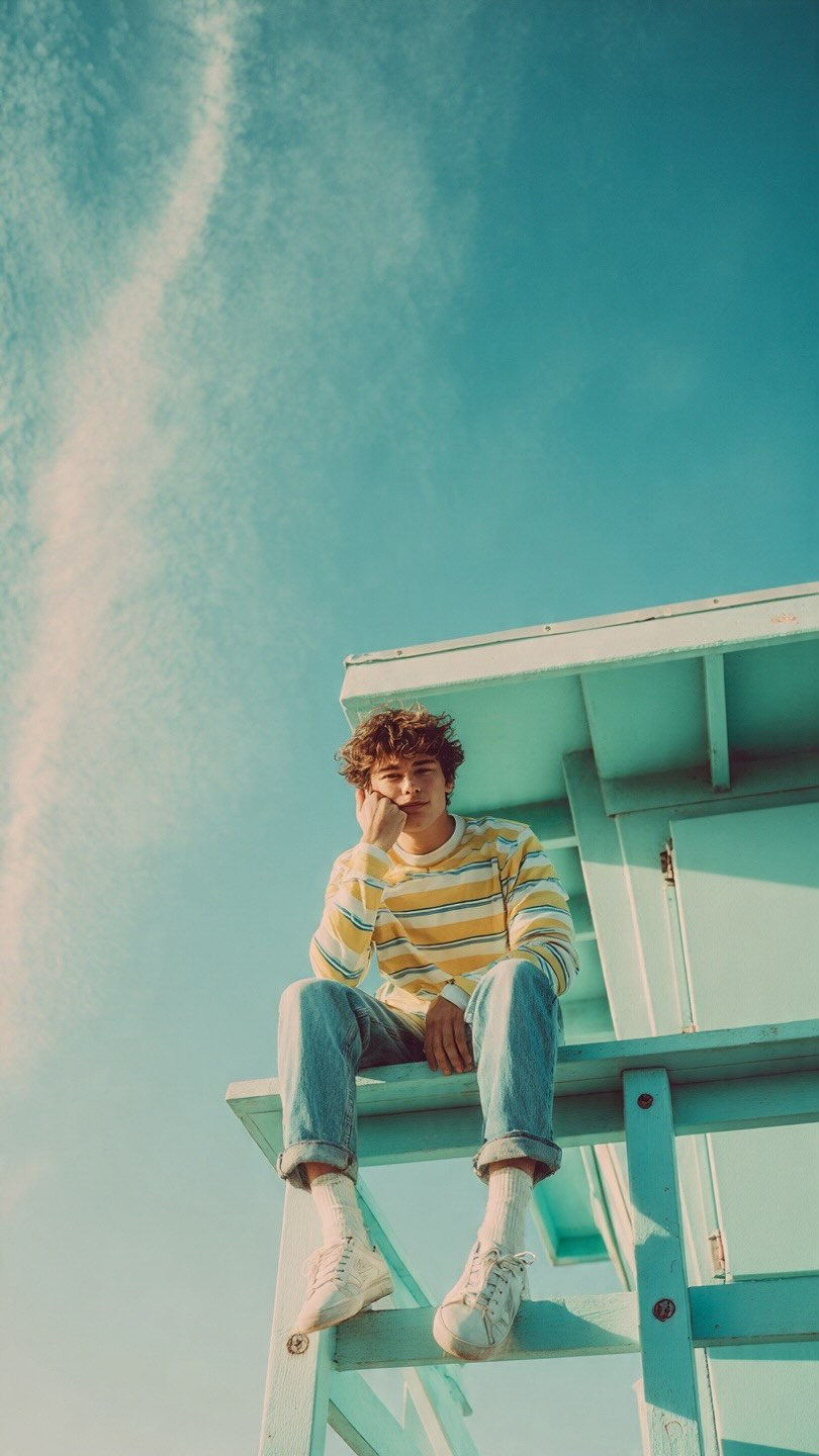 Carefree Youth on Car Rooftop