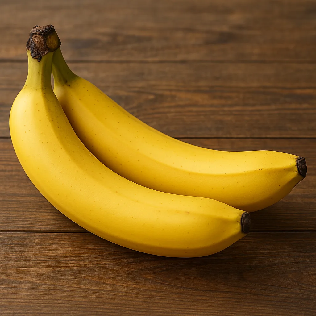 Pair of Ripe Yellow Bananas Placed on a Wooden Tabletop