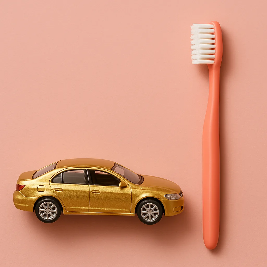 Coral-colored Toothbrush Positioned Next to a Golden Car That’s