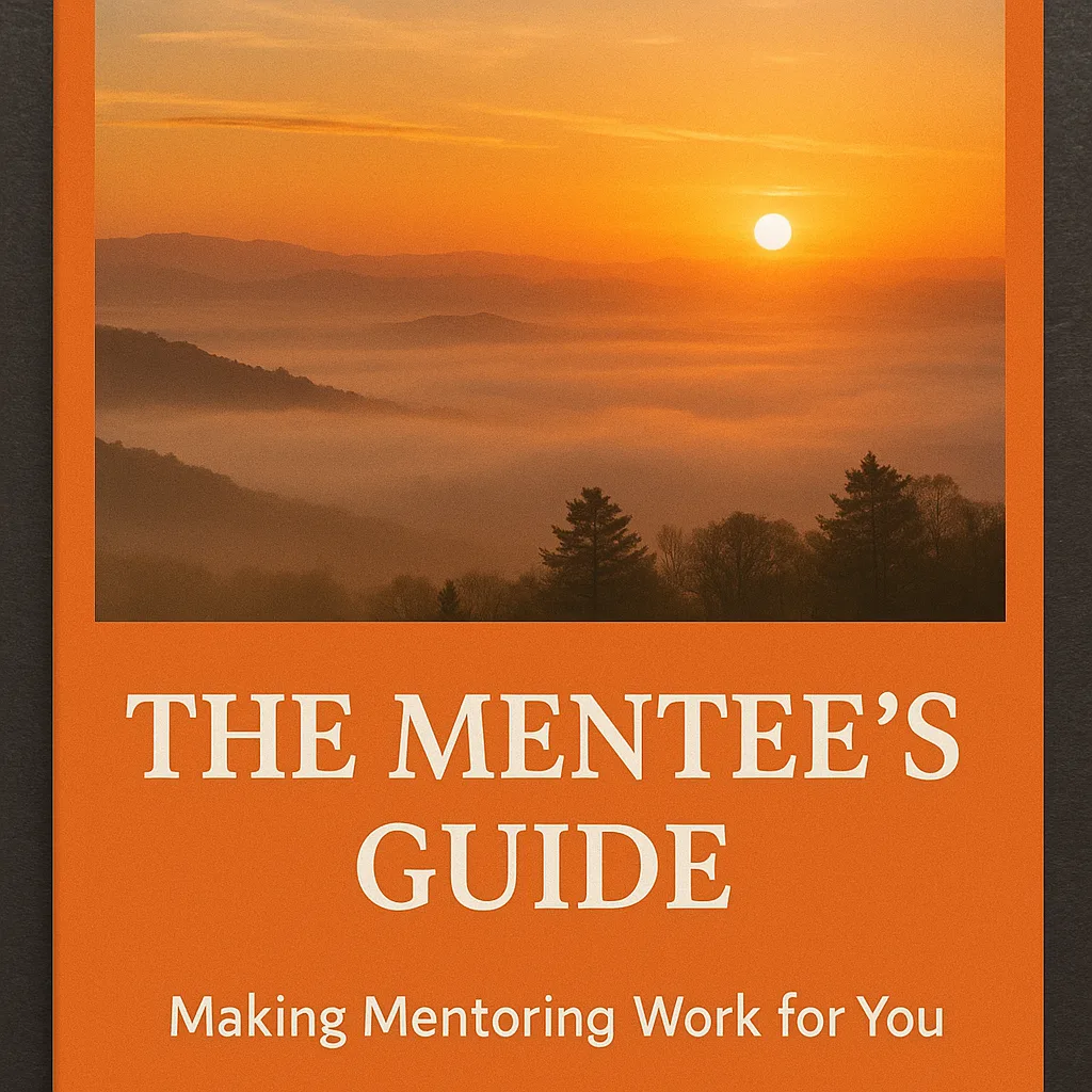 Orange Book Cover Featuring "The Mentee's Guide" Title