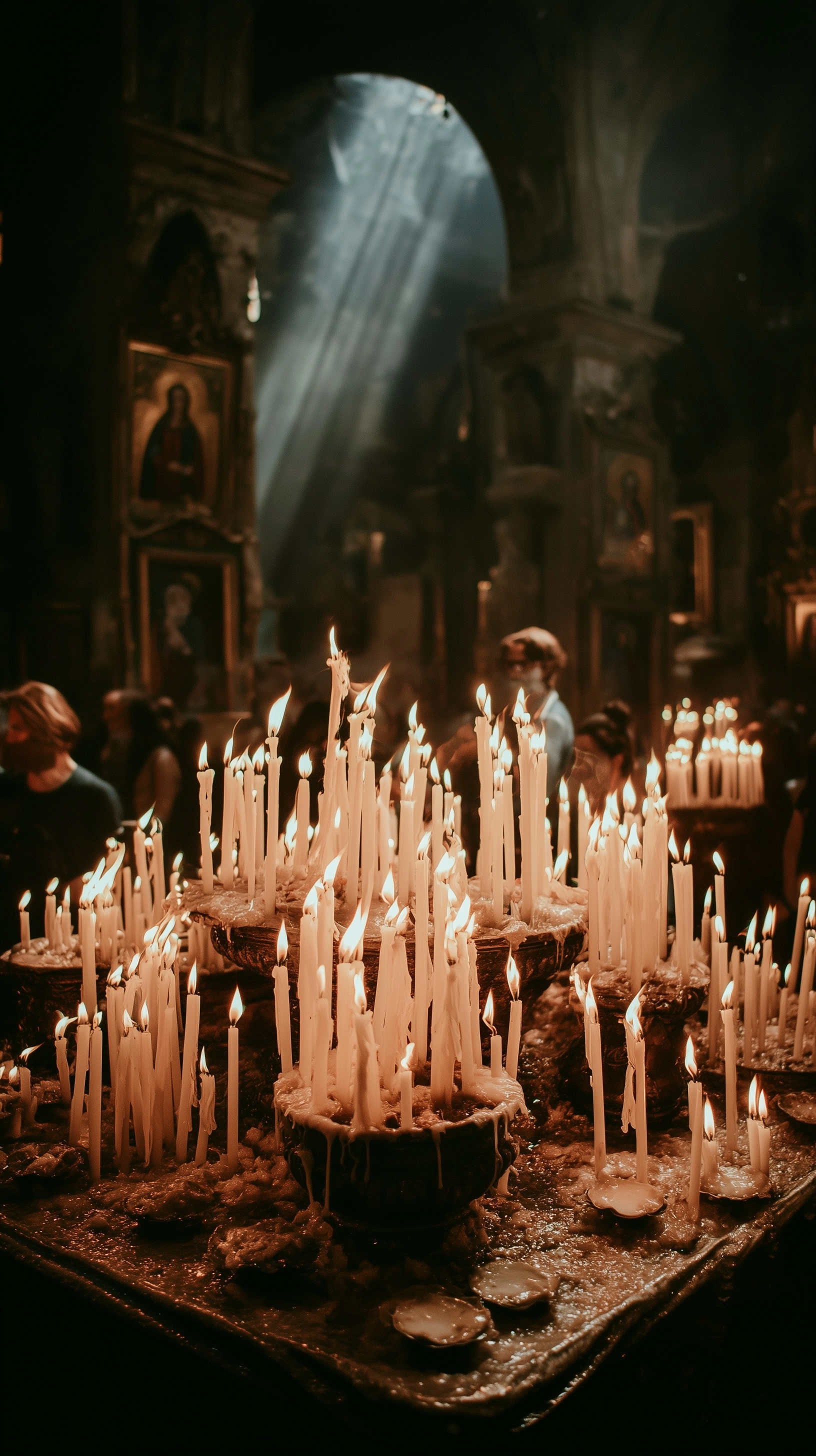 Cinematic close-up of multiple burning candles inside a catholic church