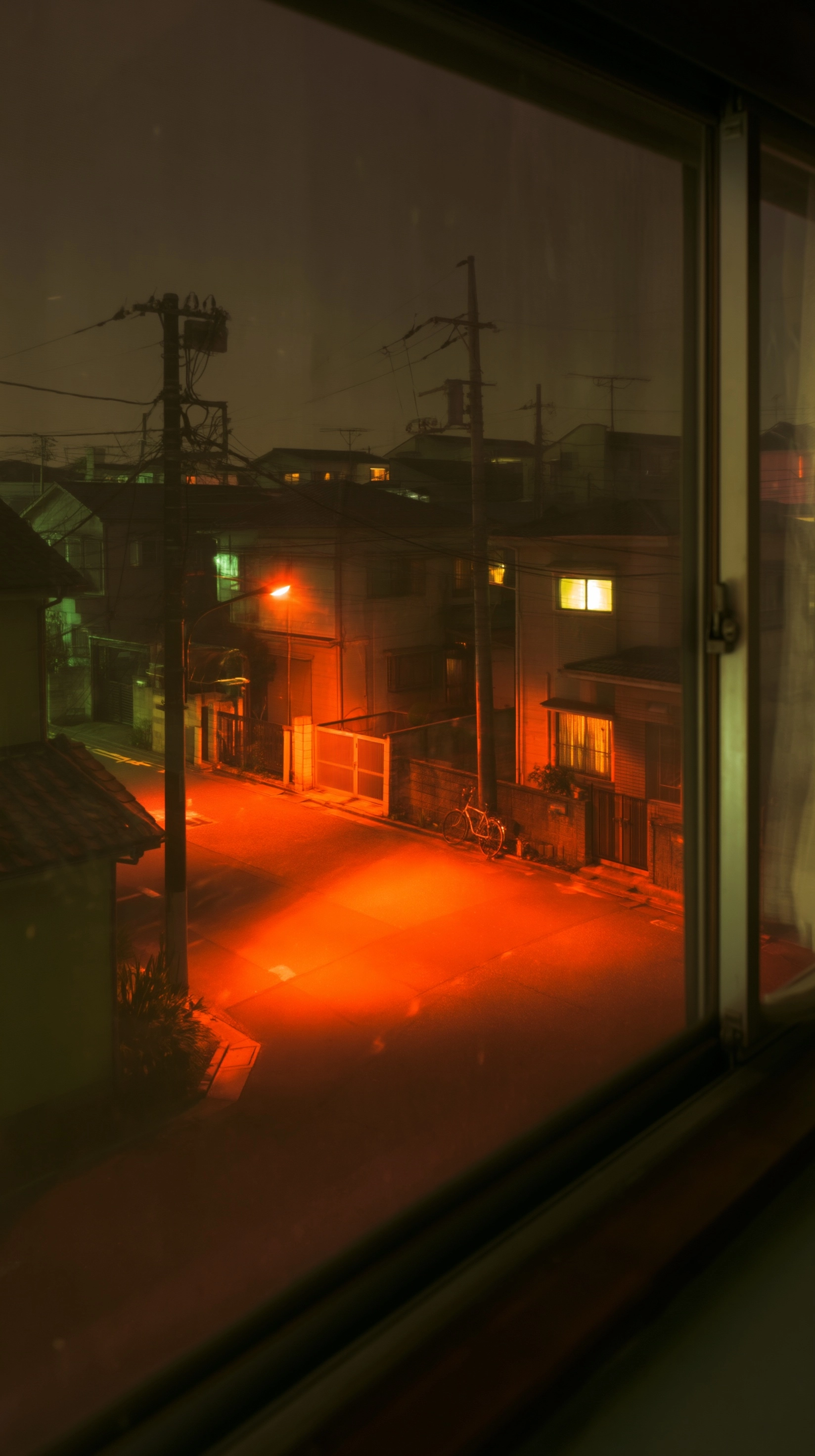 View from a second floor child's bedroom window at night, Tokyo residential neighborhood 1980s