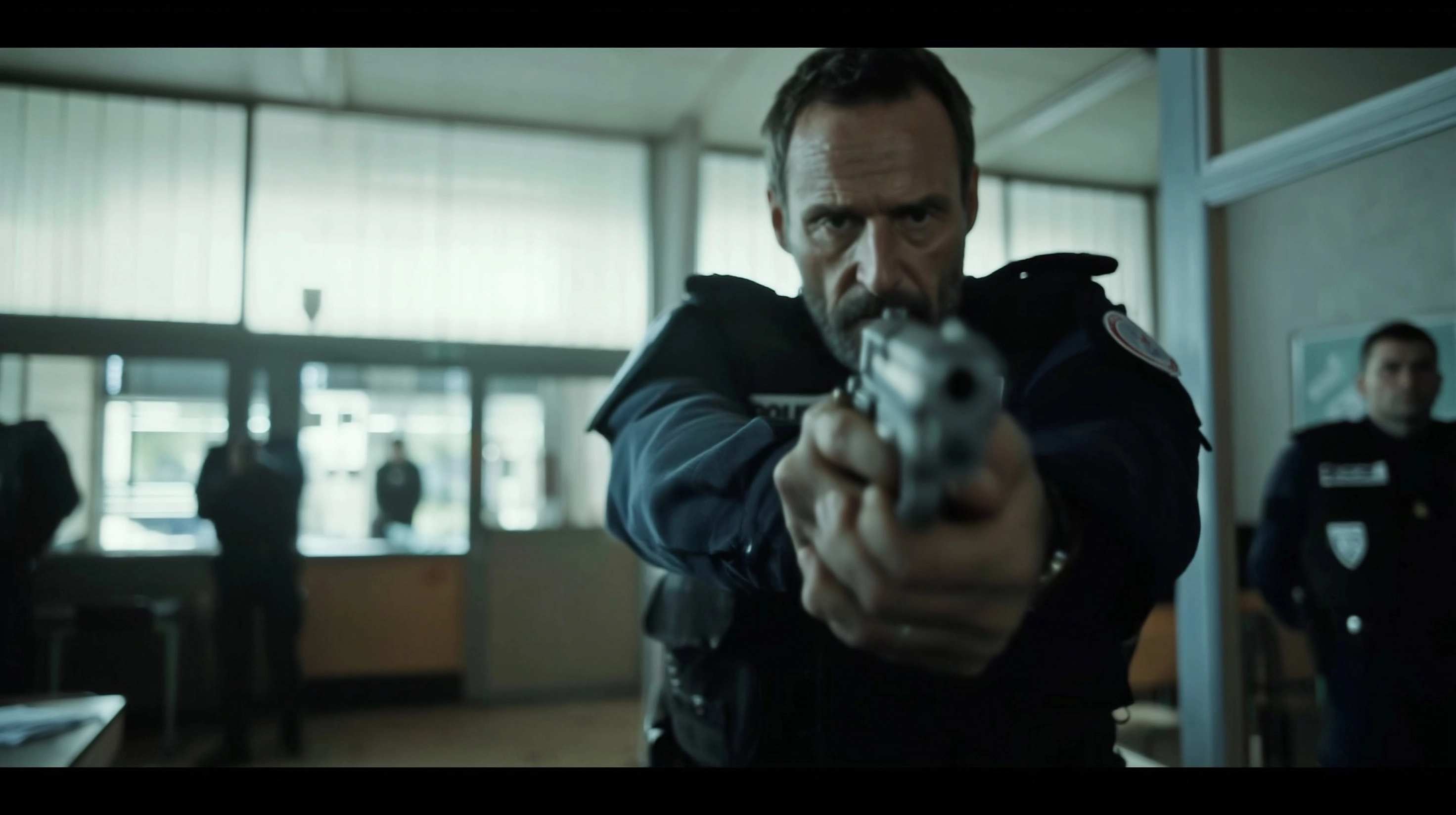 David Fincher movie still of the bodycam pov of the inside of a French project suburb police station