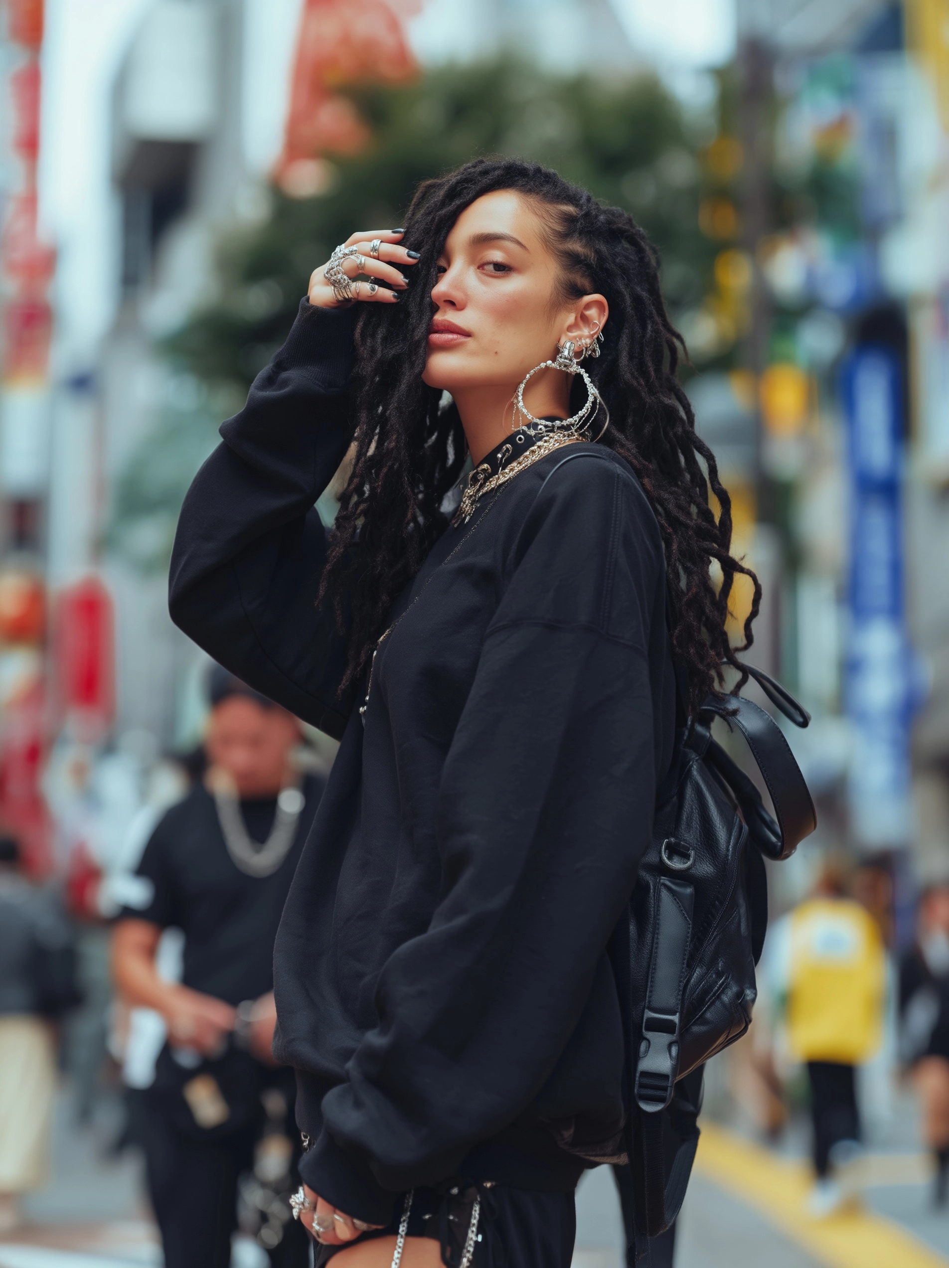 An Asian female fashion model with black dreadlocks