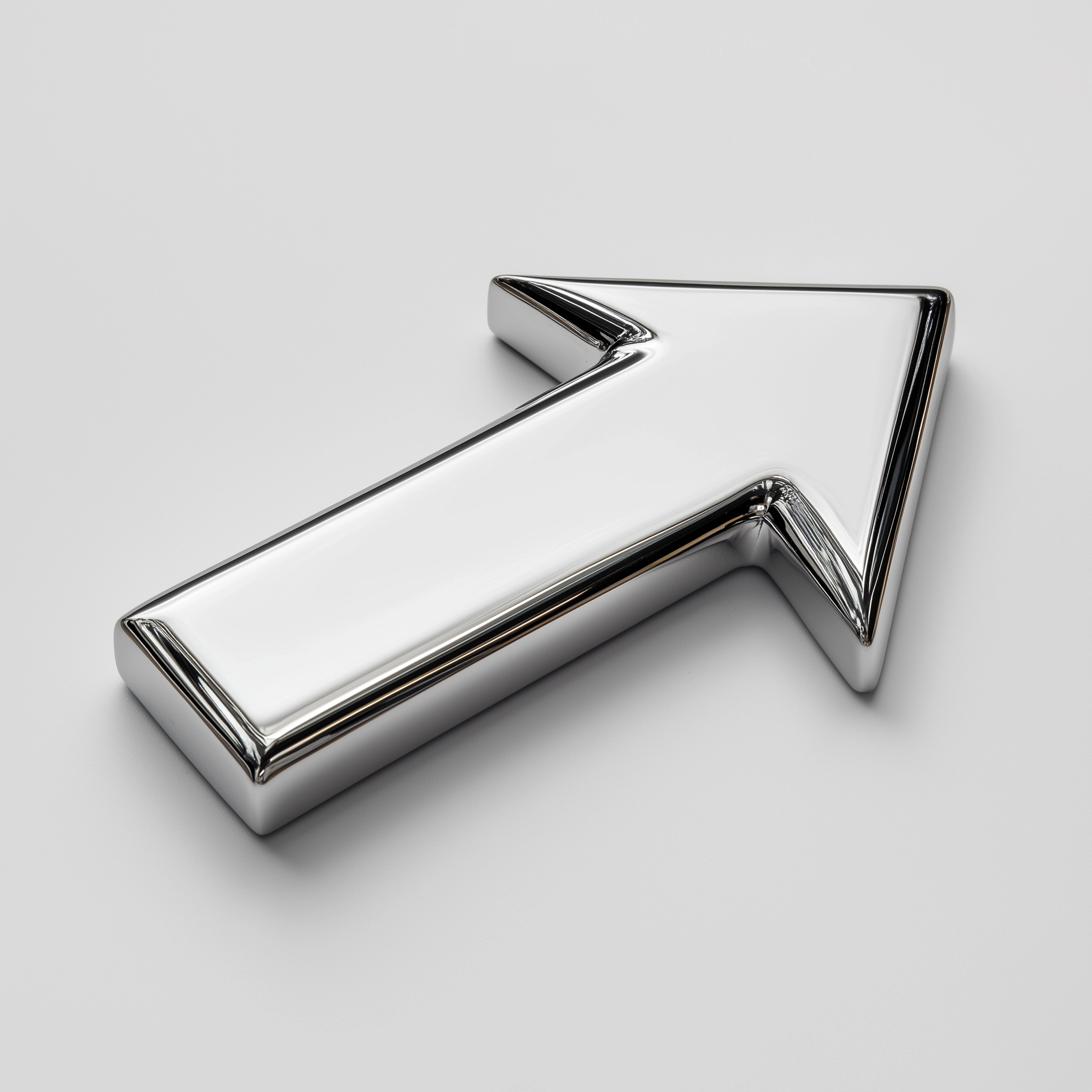 Photograph of a shiny, single sided chrome arrow on white background, 3/4 view
