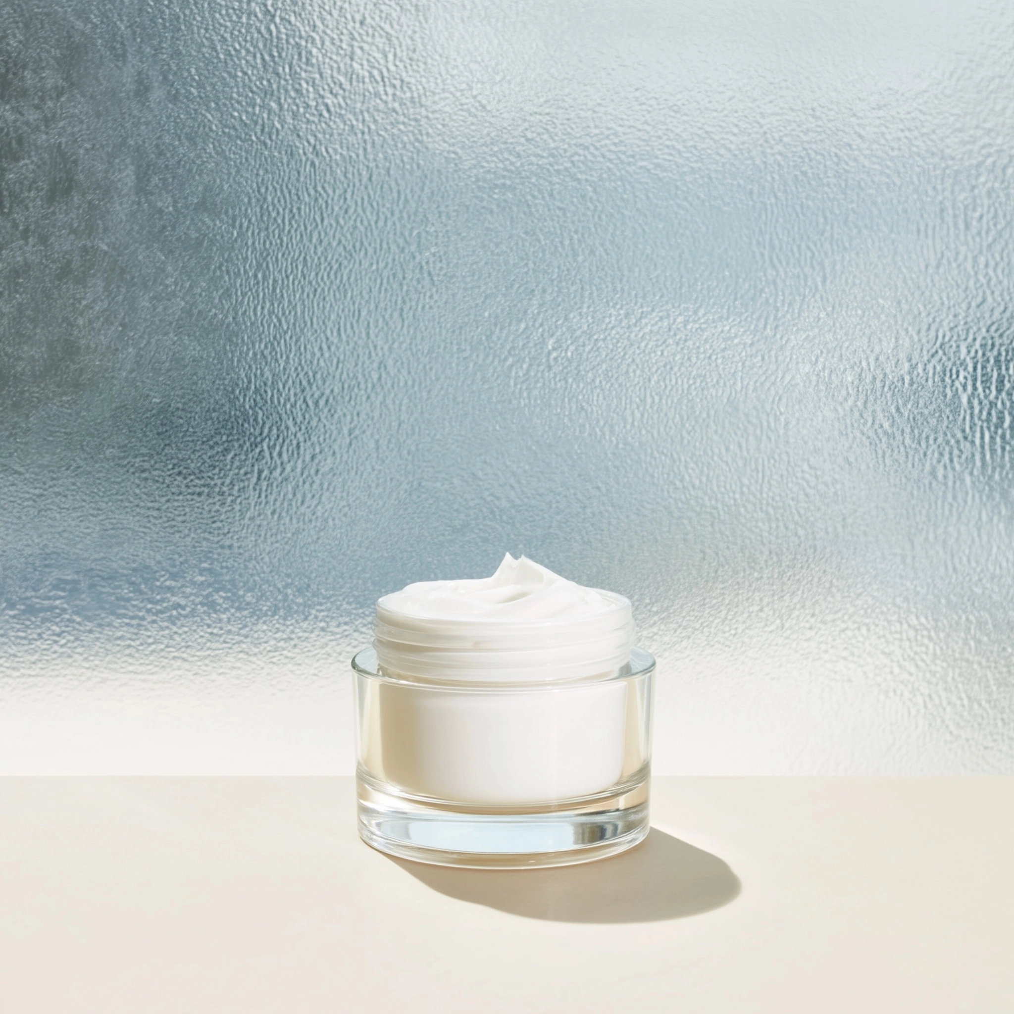 Type: Hero Shot what we see: The cream standing on a pale clean surface inside a bright modern lab w