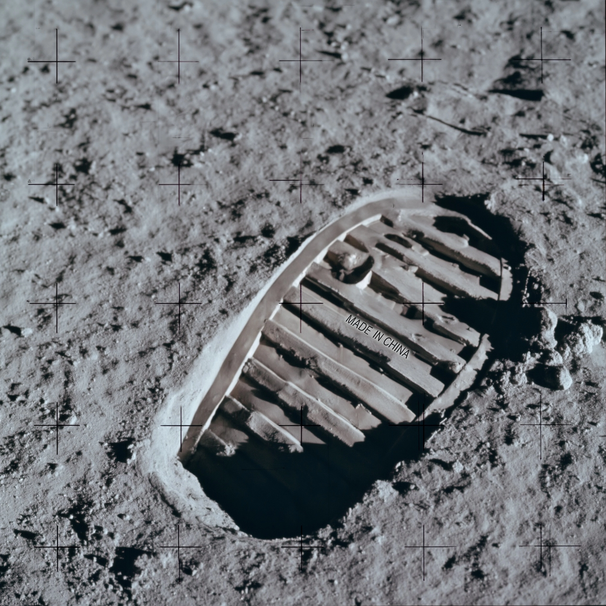 Close up shot iconic first moon foot print in the moon surface boot to bottom left NASA photo fine b