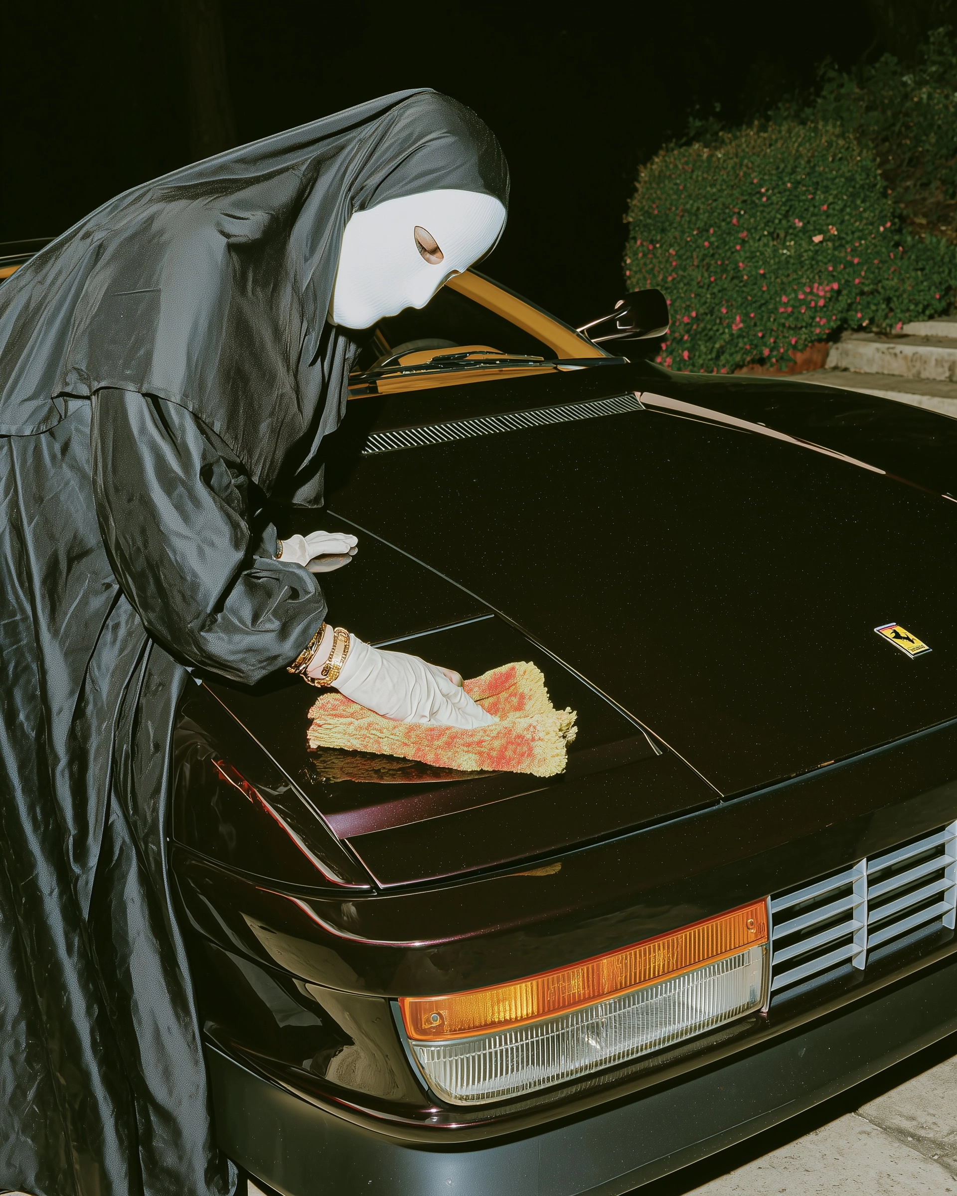 High quality editorial photography of an old woman cleaning a ferrari in southern italy