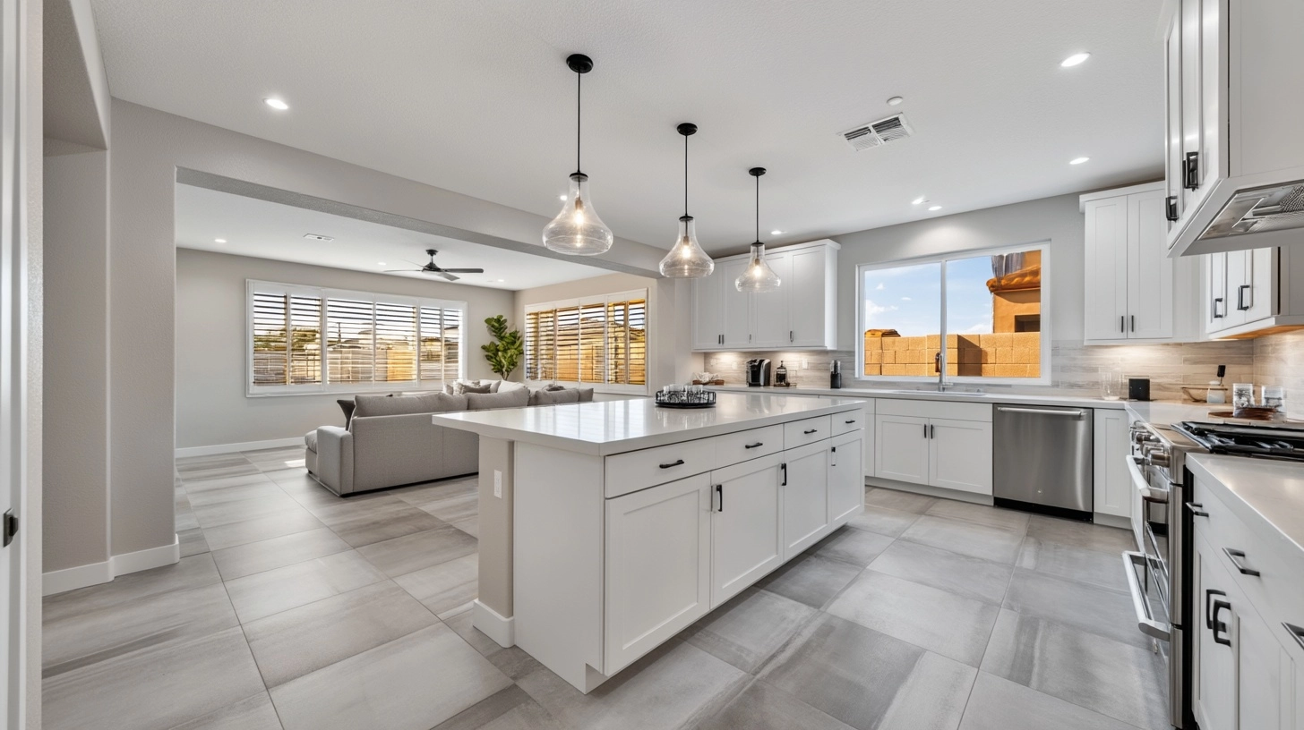 1. KITCHEN (facing east toward living room): Professional real estate photograph of a new constructi