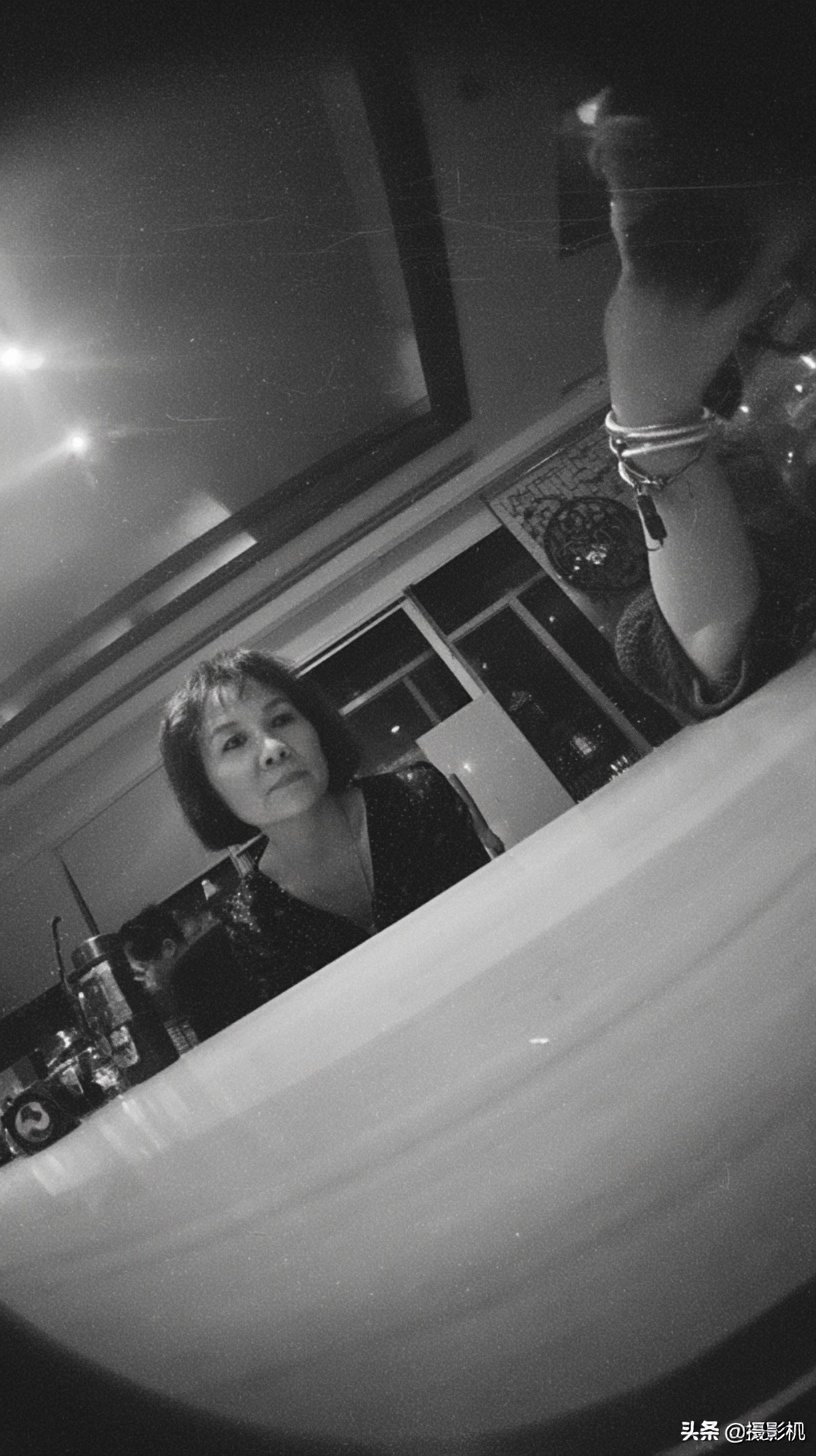 Pinhole Camera View of a Woman at a Table