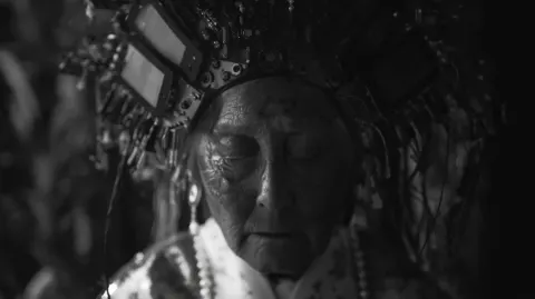 Frontal portrait of a old woman in traditional dress
