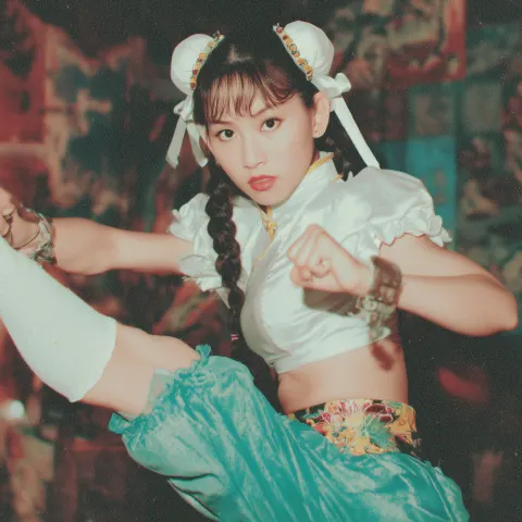 Zhao Lusi as Chun Li from streetfighter in a action pose, realistic, kodak film photo