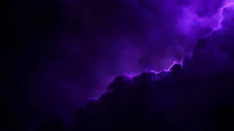 Vast dark purple nebula drifting in deep space, layered cosmic dust creating profound depth