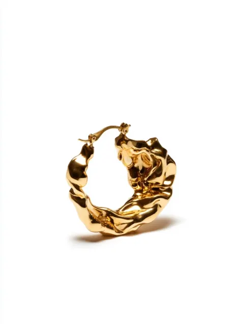 A golden hoop earring with an abstract, organic shape, featuring a fluid and sculptural design