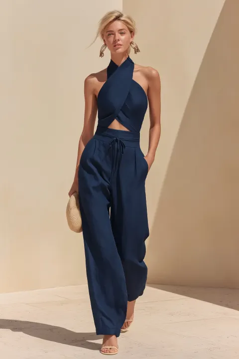 A sophisticated full-body portrait highlighting her attire. The photo showcases a 35-year-old blonde