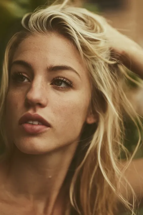 Photorealistic close-up portrait of a 25-year-old Scandinavian girl, thin dry aging skin