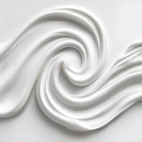 A stream of sinous yogurt with rich and thick texture on isolated background
