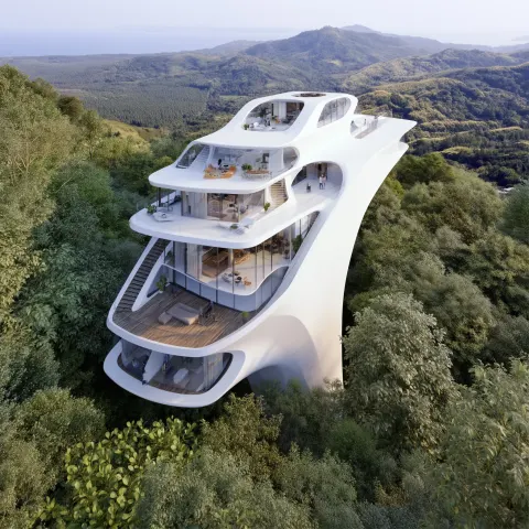 Aerial view of the three-level, white, futuristic apartment building with balconies and terraces