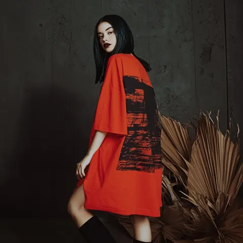 Studio fashion photo of girl wearing oversize t-shirt