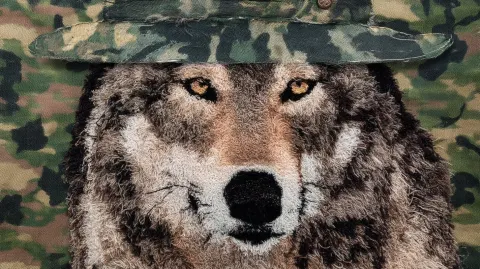 Distressed chenille-style, 18k portrait of wolf using yarn, puff vinyl