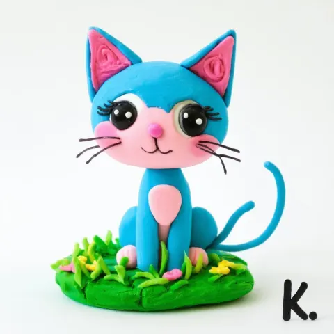Whimsical Blue Pink Clay Kitten on Grass