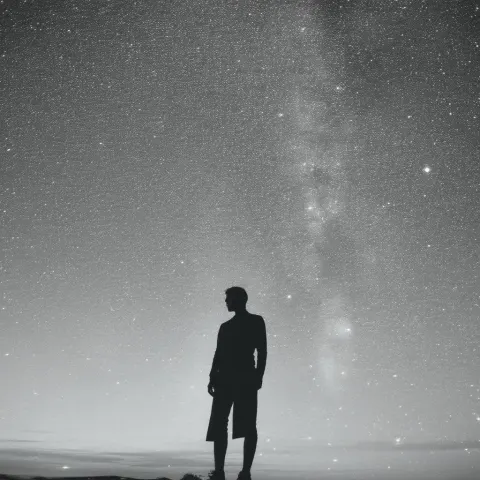 Enigmatic Monochrome Figure in Starry Desolation