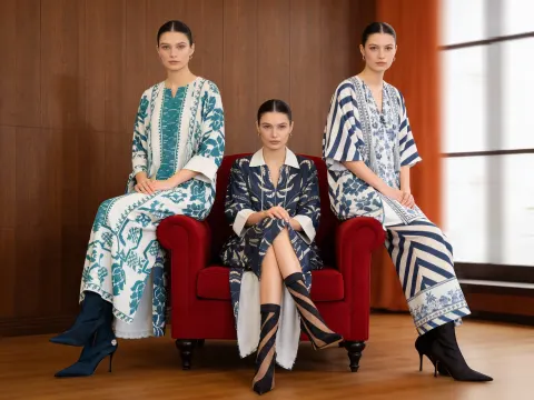 Three Women On Red Armchair