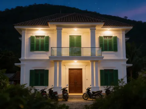 Colonial House At Night With Motorcycles